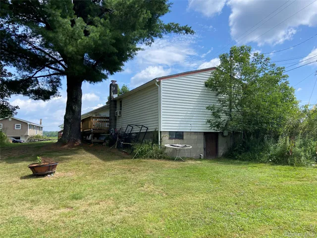 a house view with a backyard space
