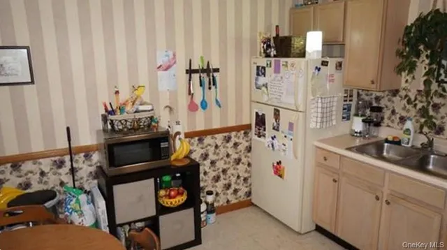 a bathroom with sink and mirror