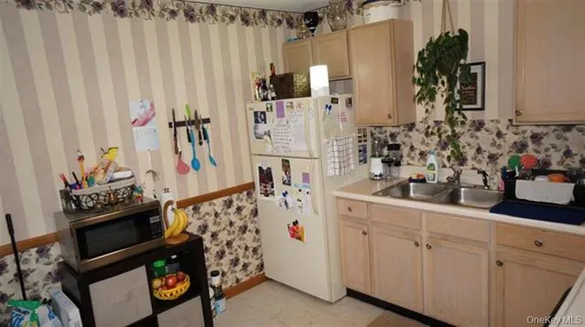 a kitchen with cabinets and window
