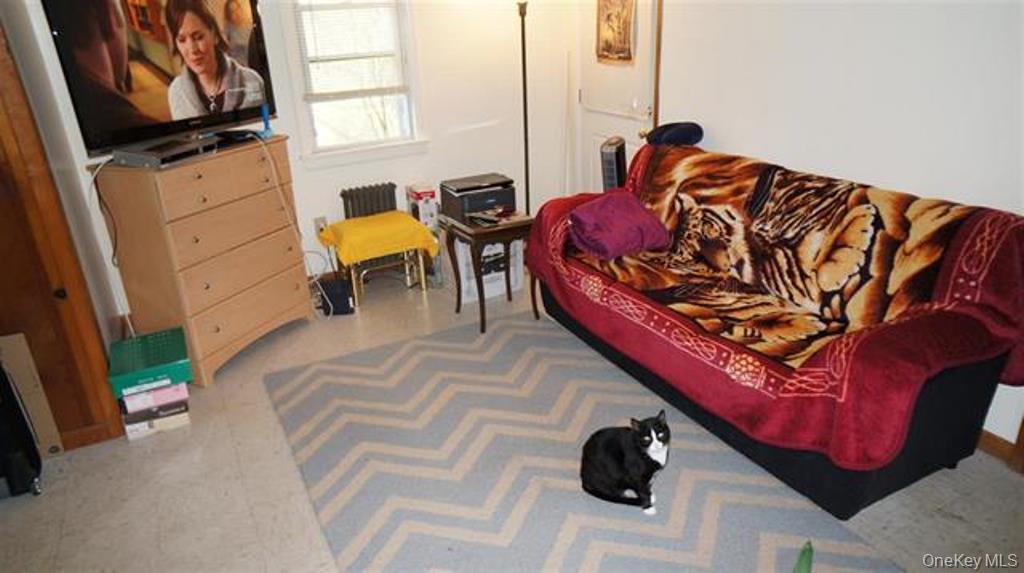 15 Bailey Lake Road Kiamesha Lake, NY 12751 - Photo 34 of 36 a bed sitting in a bedroom next to a window