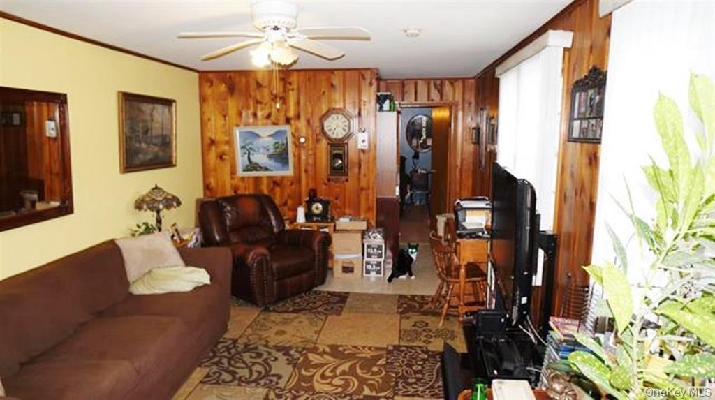 15 Bailey Lake Road Kiamesha Lake, NY 12751 - Photo 7 of 36 a living room with furniture and a flat screen tv