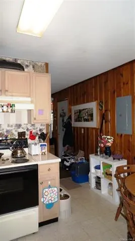 a kitchen with a sink a stove and a refrigerator