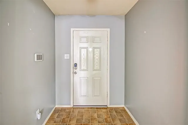 a view of walk in closet with empty room