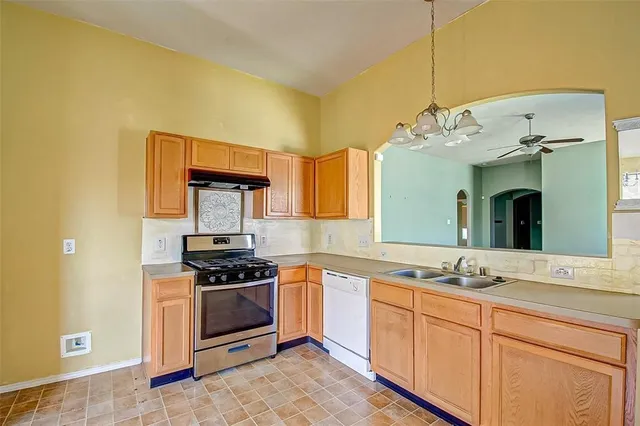 a spacious bathroom with a sink and a mirror