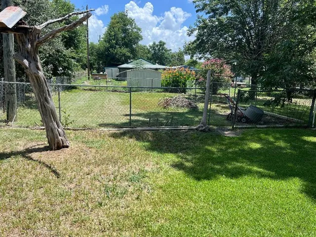 a view of a garden with an outdoor space