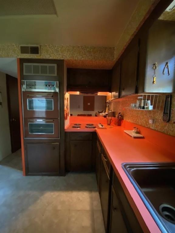 233 Elm Branch Whitney, TX 76692 - Photo 25 of 30 a kitchen with stainless steel appliances kitchen island granite countertop a sink and cabinets