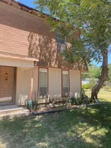 a couple of table and chairs in the yard