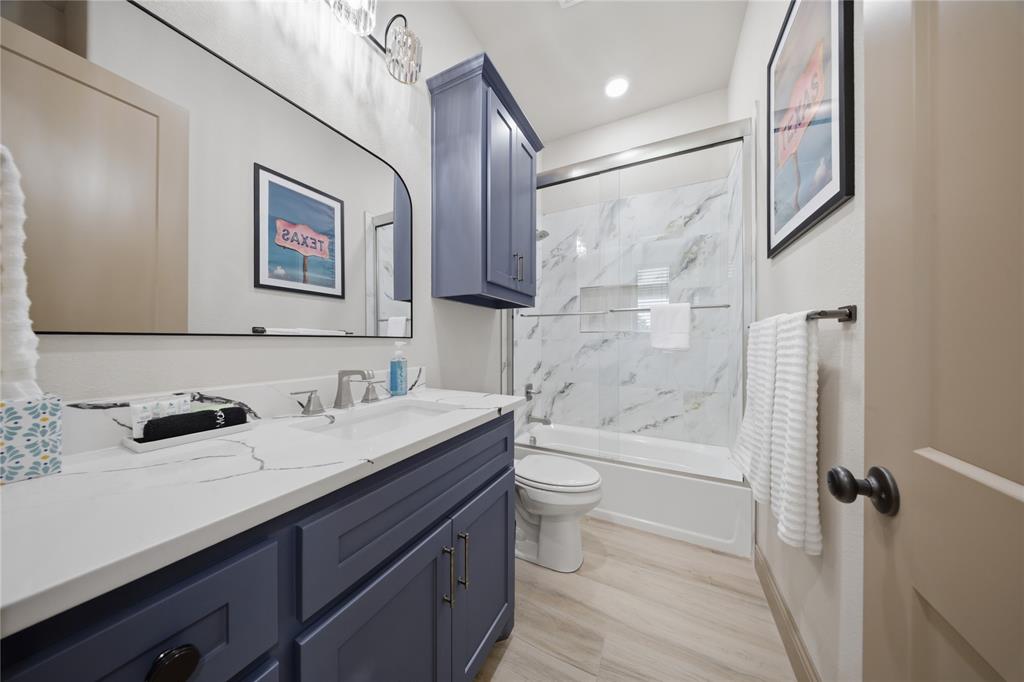 958 Cedar Mills Road Gordonville, TX 76245 - Photo 25 of 40 a bathroom with a sink a toilet and shower