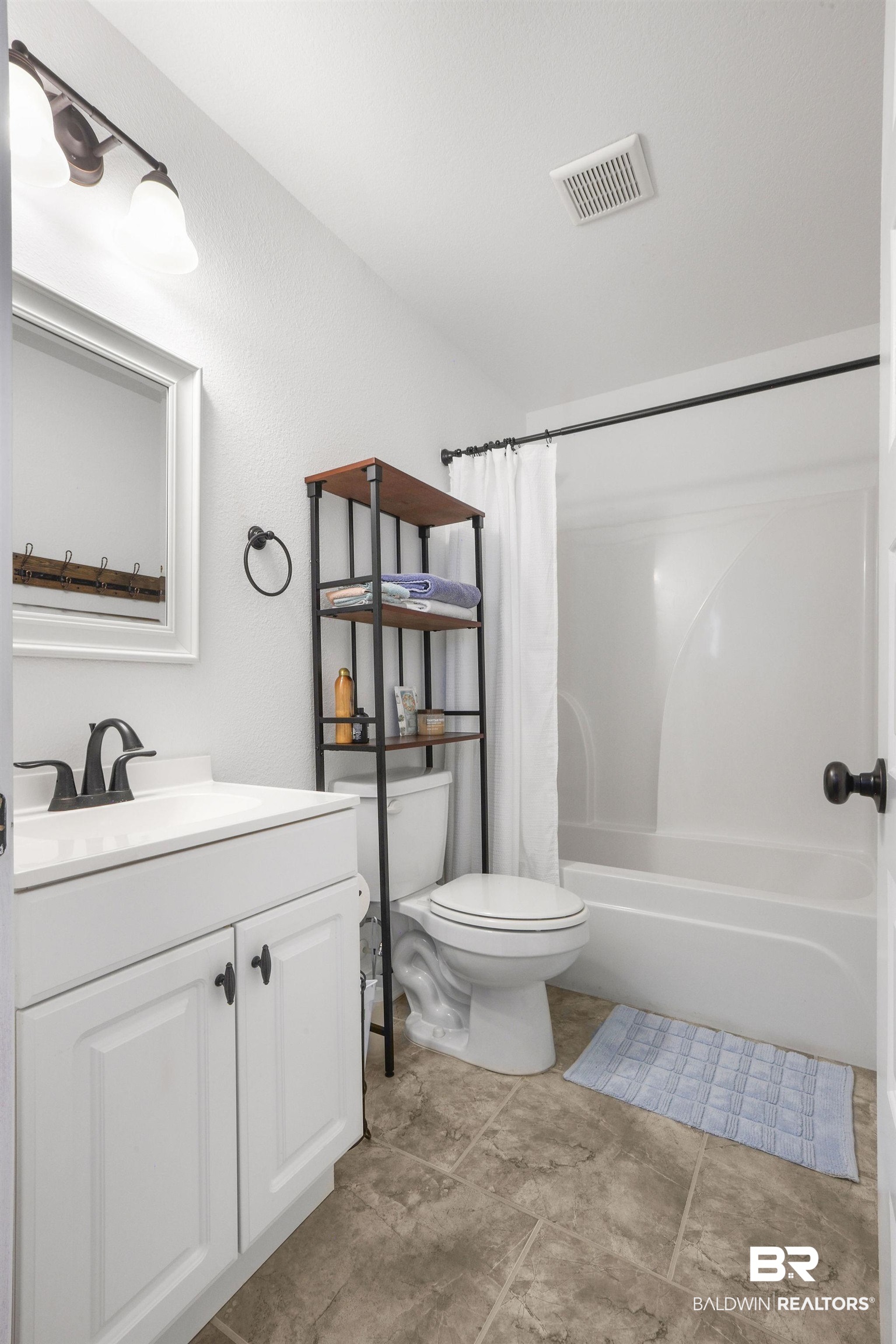 1116 Pink Poppy Lane Foley, AL 36535 - Photo 26 of 33 Full bathroom with vanity and shower / tub combo with curtain