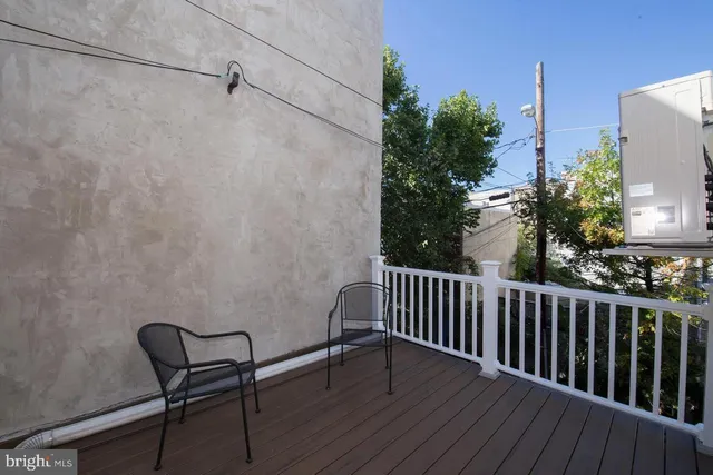 a view of a chair and table on the wooden floor