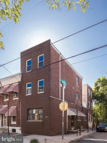 a view of a building with a street