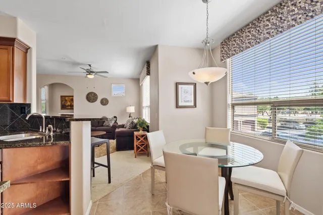 a view of a dining room with furniture window and outside view