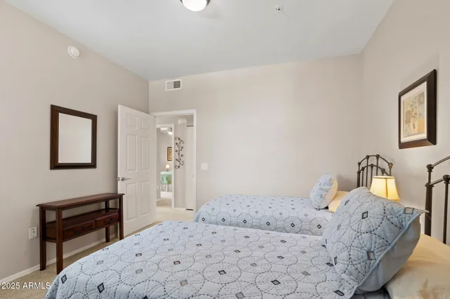 a bedroom with a bed and a dresser