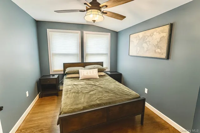 a bedroom with a bed and window