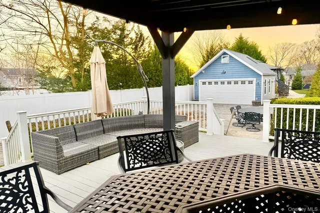 a view of a balcony with furniture