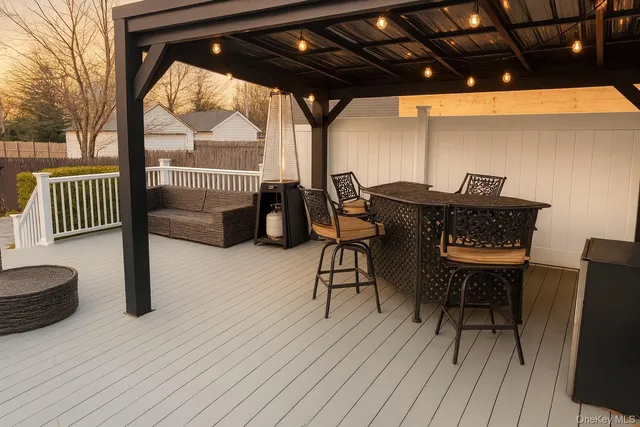 a view of a chairs and table on the deck
