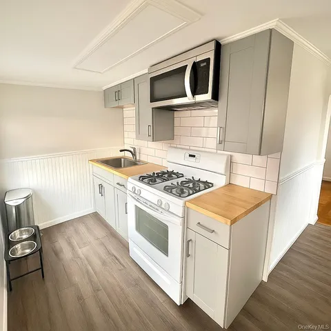 a kitchen with a stove and a microwave