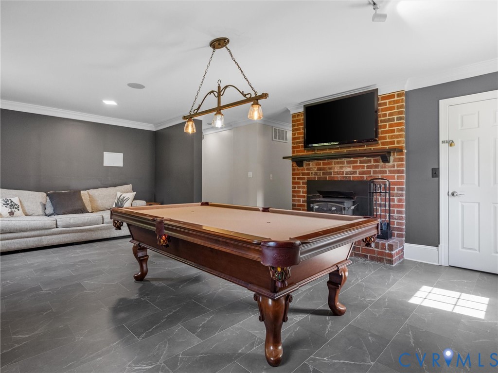 13099 Cedon Road Ashland, VA 23005 - Photo 55 of 92 Lower level game room, tile flooring, white crown