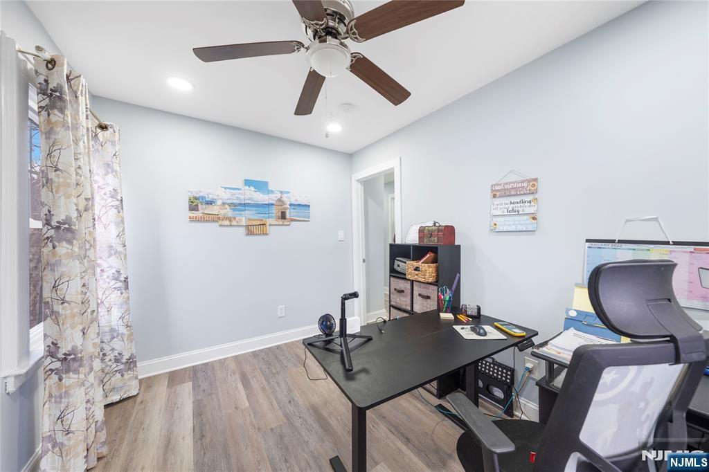 61-63 Keer Avenue Newark, NJ 07112 - Photo 15 of 33 a workspace with furniture and wooden floor