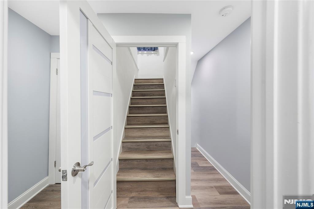 61-63 Keer Avenue Newark, NJ 07112 - Photo 16 of 33 a view of a hallway with wooden floor and entryway