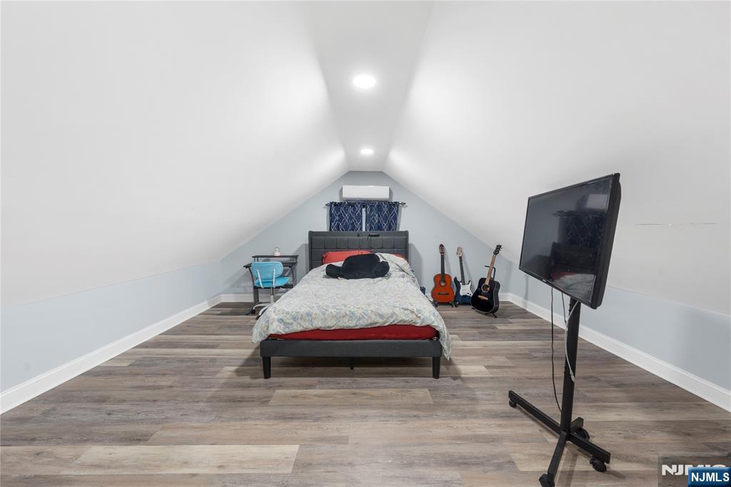 61-63 Keer Avenue Newark, NJ 07112 - Photo 17 of 33 a bedroom with bed and window