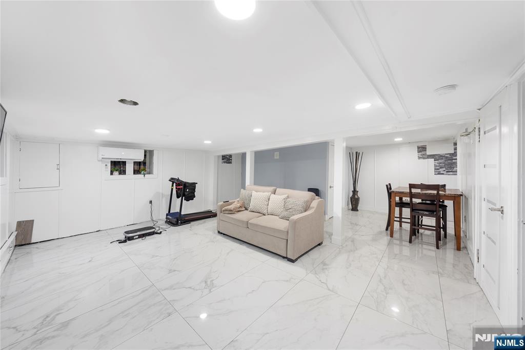 61-63 Keer Avenue Newark, NJ 07112 - Photo 19 of 33 a living room with furniture and a table