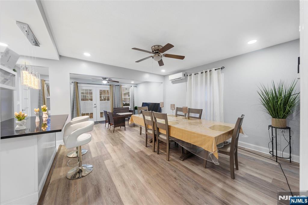 61-63 Keer Avenue Newark, NJ 07112 - Photo 4 of 33 a living room with furniture a table and wooden floor