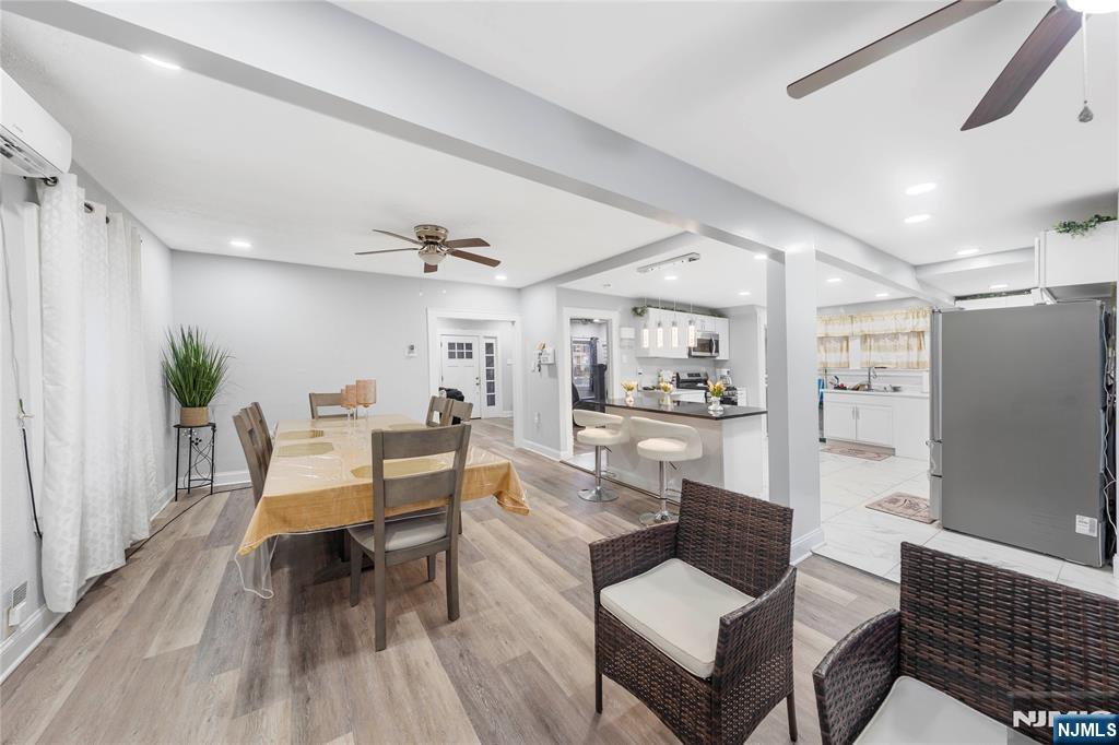 61-63 Keer Avenue Newark, NJ 07112 - Photo 6 of 33 a living room with furniture and a wooden floor