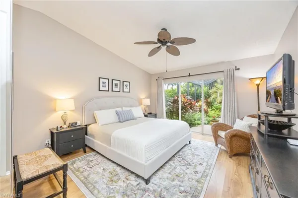 a bedroom with a large bed and a couch