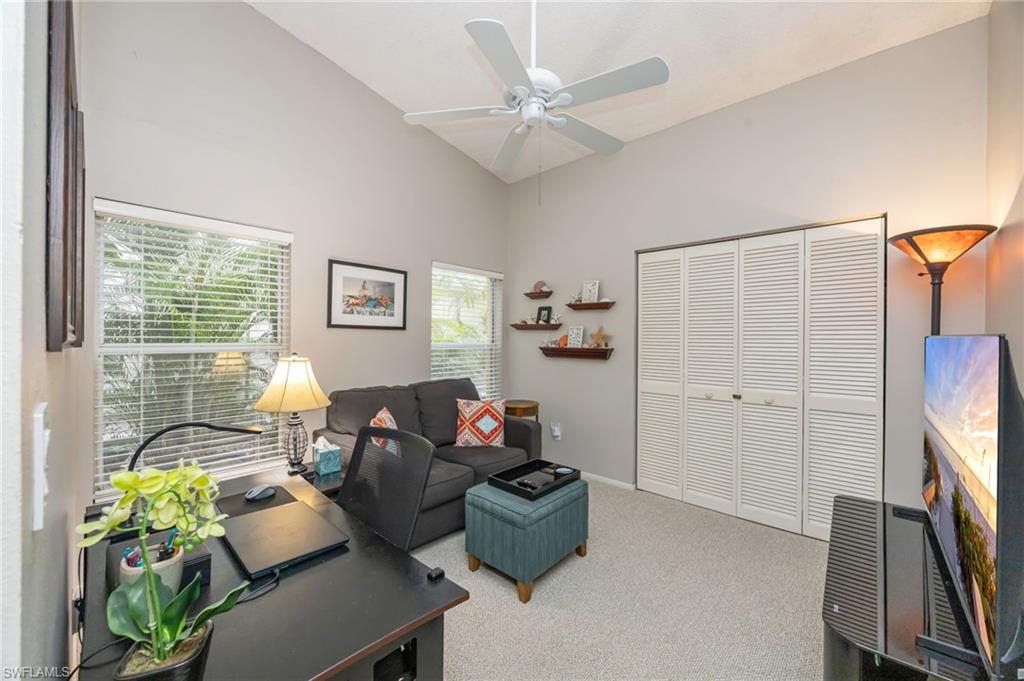 7546 Mill Pond Circle Naples, FL 34109 - Photo 18 of 32 a living room with furniture and a flat screen tv