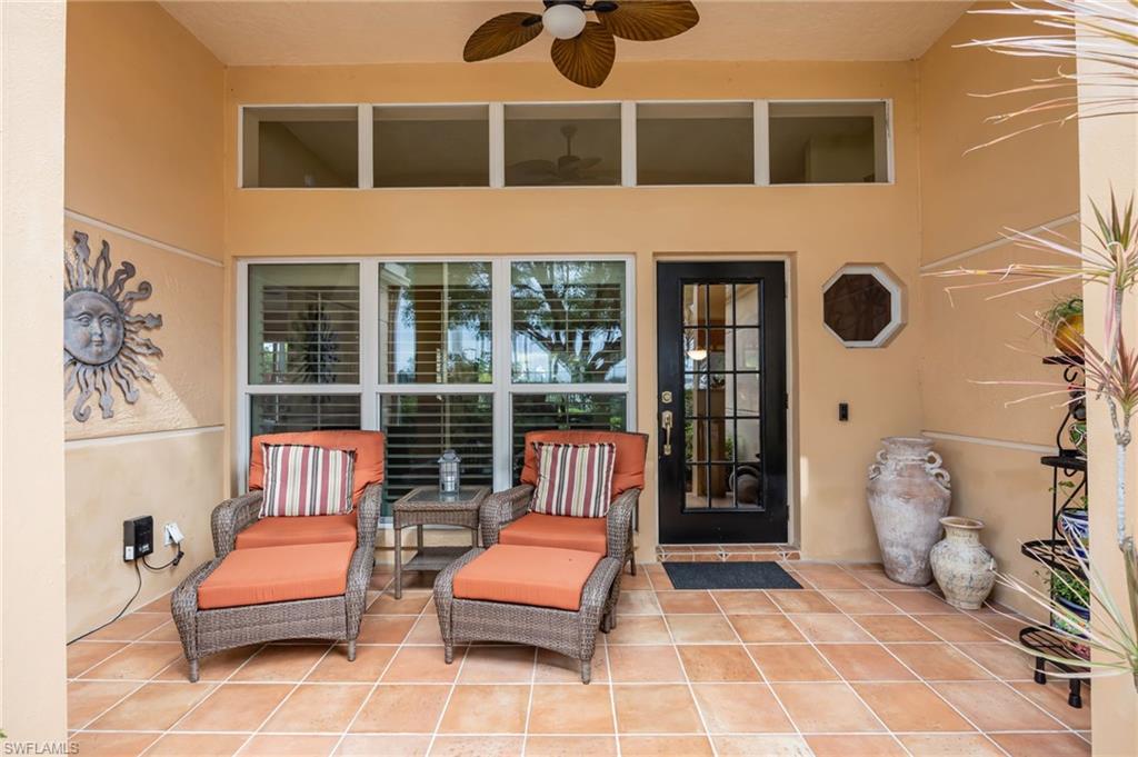 7546 Mill Pond Circle Naples, FL 34109 - Photo 2 of 32 a bedroom with a bed and a couch