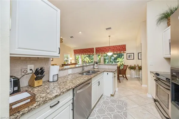 a kitchen with lots of counter top space and a sink