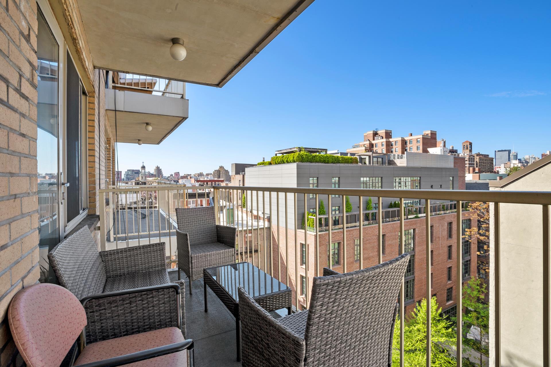a view of a balcony with furniture
