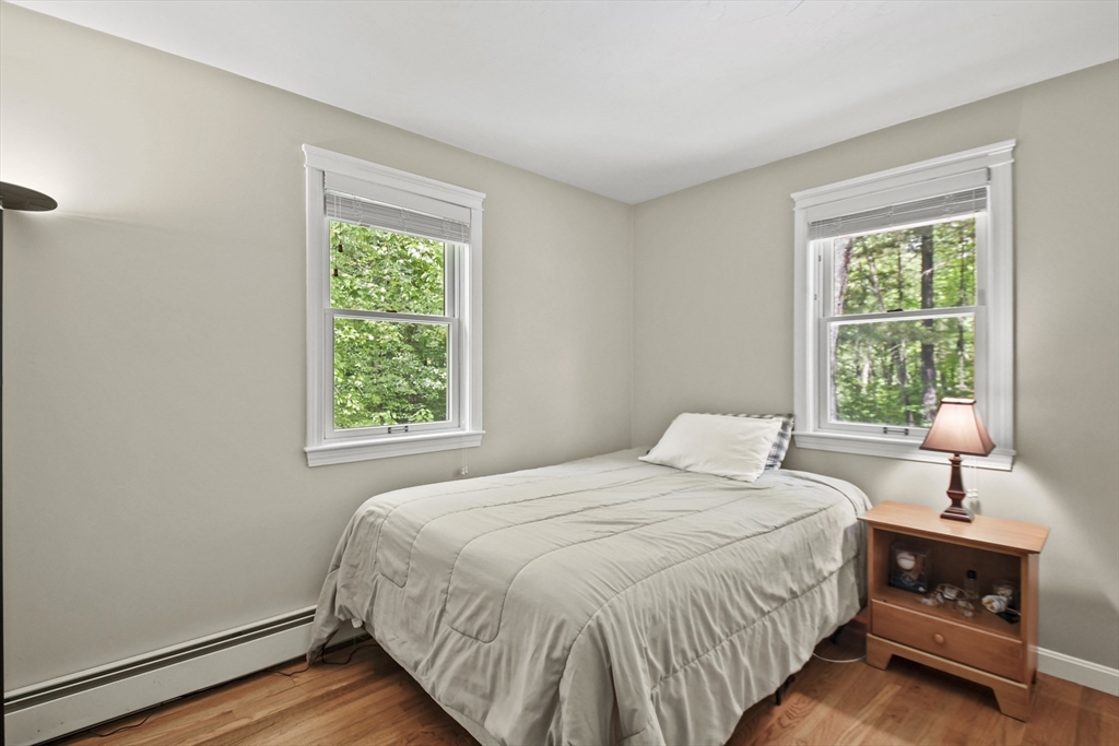 23 Cove Road Lunenburg, MA 01462 - Photo 20 of 42 a bedroom with a bed and a window