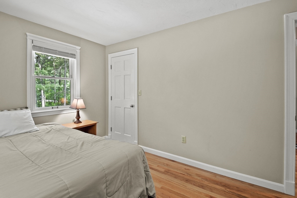 23 Cove Road Lunenburg, MA 01462 - Photo 21 of 42 a bedroom with a bed and a window