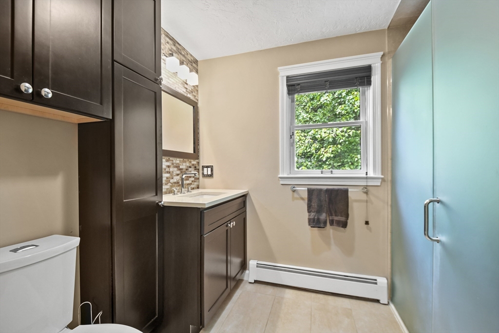 23 Cove Road Lunenburg, MA 01462 - Photo 25 of 42 a bathroom with a sink a toilet and shower