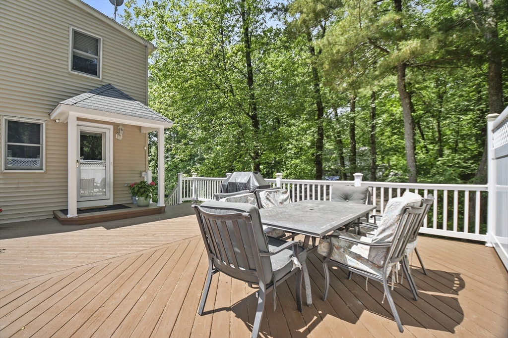23 Cove Road Lunenburg, MA 01462 - Photo 32 of 42 a view of a chairs and table on the wooden floor