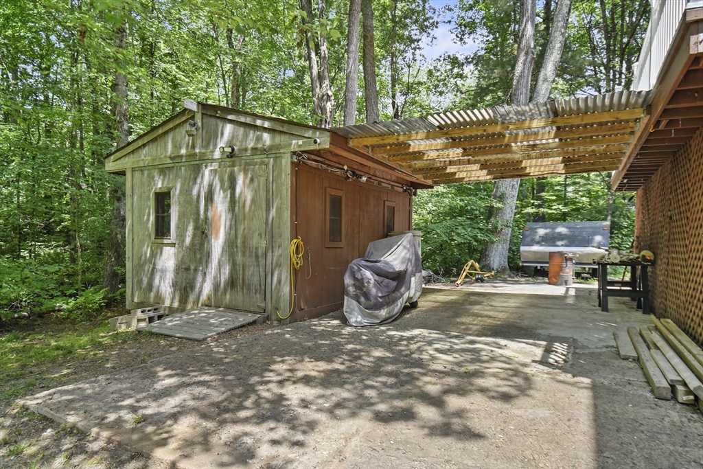 23 Cove Road Lunenburg, MA 01462 - Photo 34 of 42 a view of a house with backyard and trees
