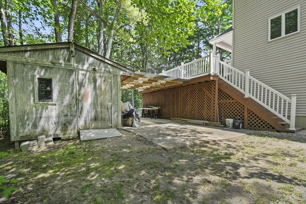 23 Cove Road Lunenburg, MA 01462 - Photo 35 of 42 a backyard of a house with lots of green space