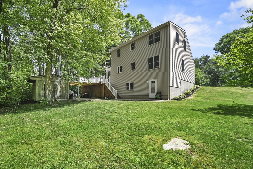 23 Cove Road Lunenburg, MA 01462 - Photo 36 of 42 a view of a back yard of the house