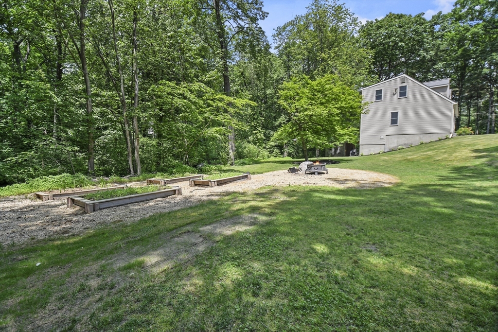 23 Cove Road Lunenburg, MA 01462 - Photo 39 of 42 a backyard of a house with lots of green space
