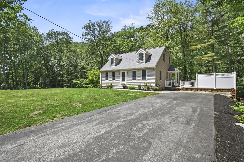 23 Cove Road Lunenburg, MA 01462 - Photo 4 of 42 a front view of a house with a yard