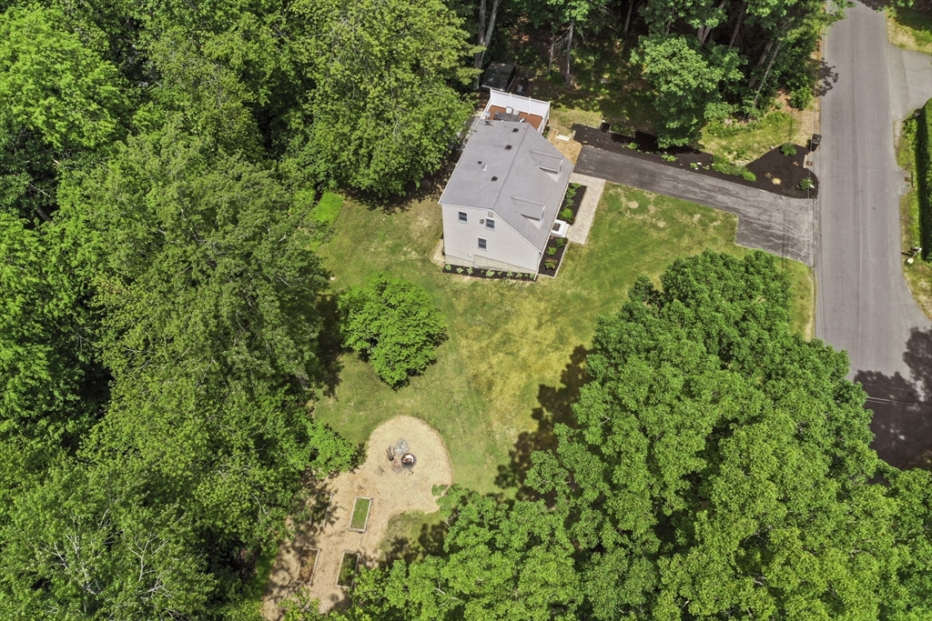 23 Cove Road Lunenburg, MA 01462 - Photo 42 of 42 an aerial view of a house with a garden and trees