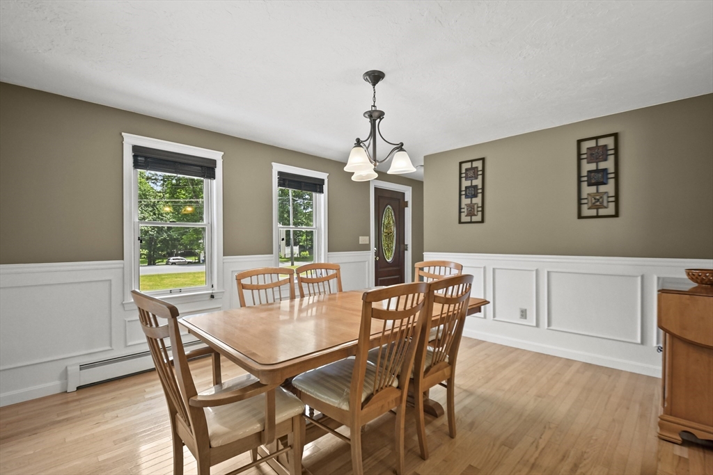 23 Cove Road Lunenburg, MA 01462 - Photo 7 of 42 a view of a dining room with furniture window and wooden floor