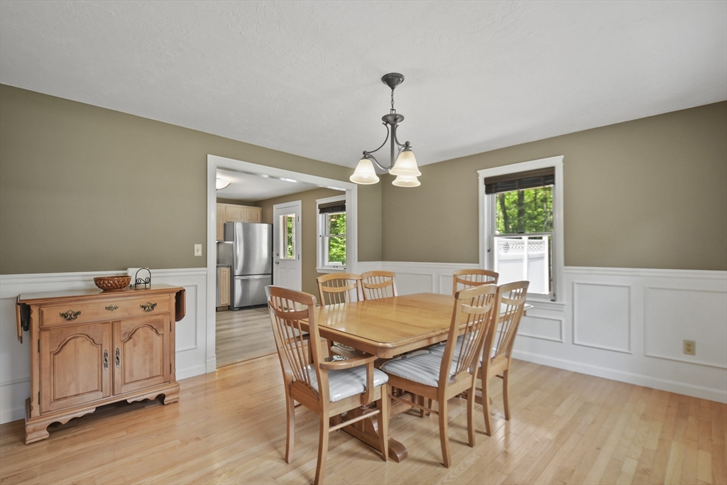 23 Cove Road Lunenburg, MA 01462 - Photo 9 of 42 a view of a dining room with furniture window and wooden floor