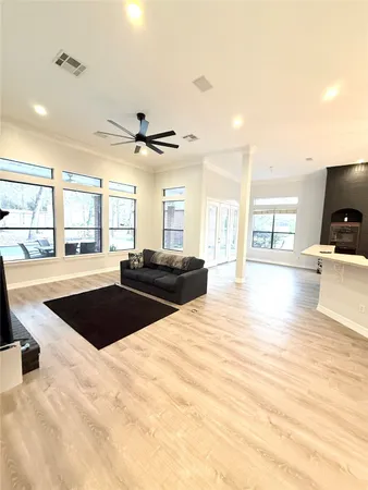 a living room with a couch and a large window