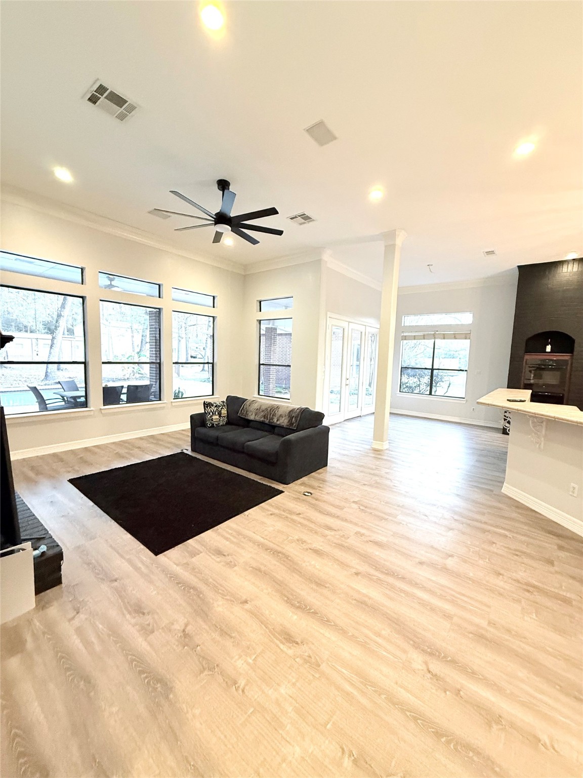 15567 Old Conroe Road Conroe, TX 77384 - Photo 20 of 31 a living room with a couch and a large window