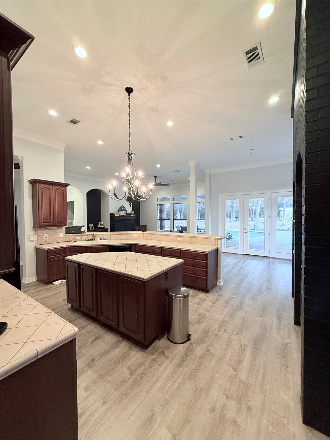 15567 Old Conroe Road Conroe, TX 77384 - Photo 23 of 31 a large kitchen with a large center island and stainless steel appliances