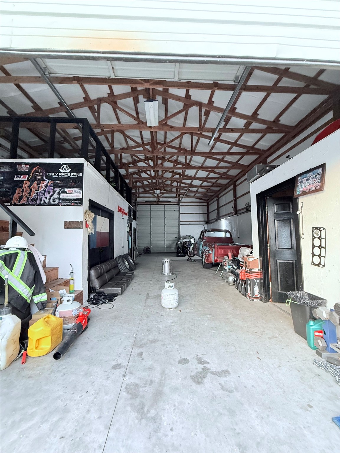 15567 Old Conroe Road Conroe, TX 77384 - Photo 29 of 31 a view of parking garage with cars