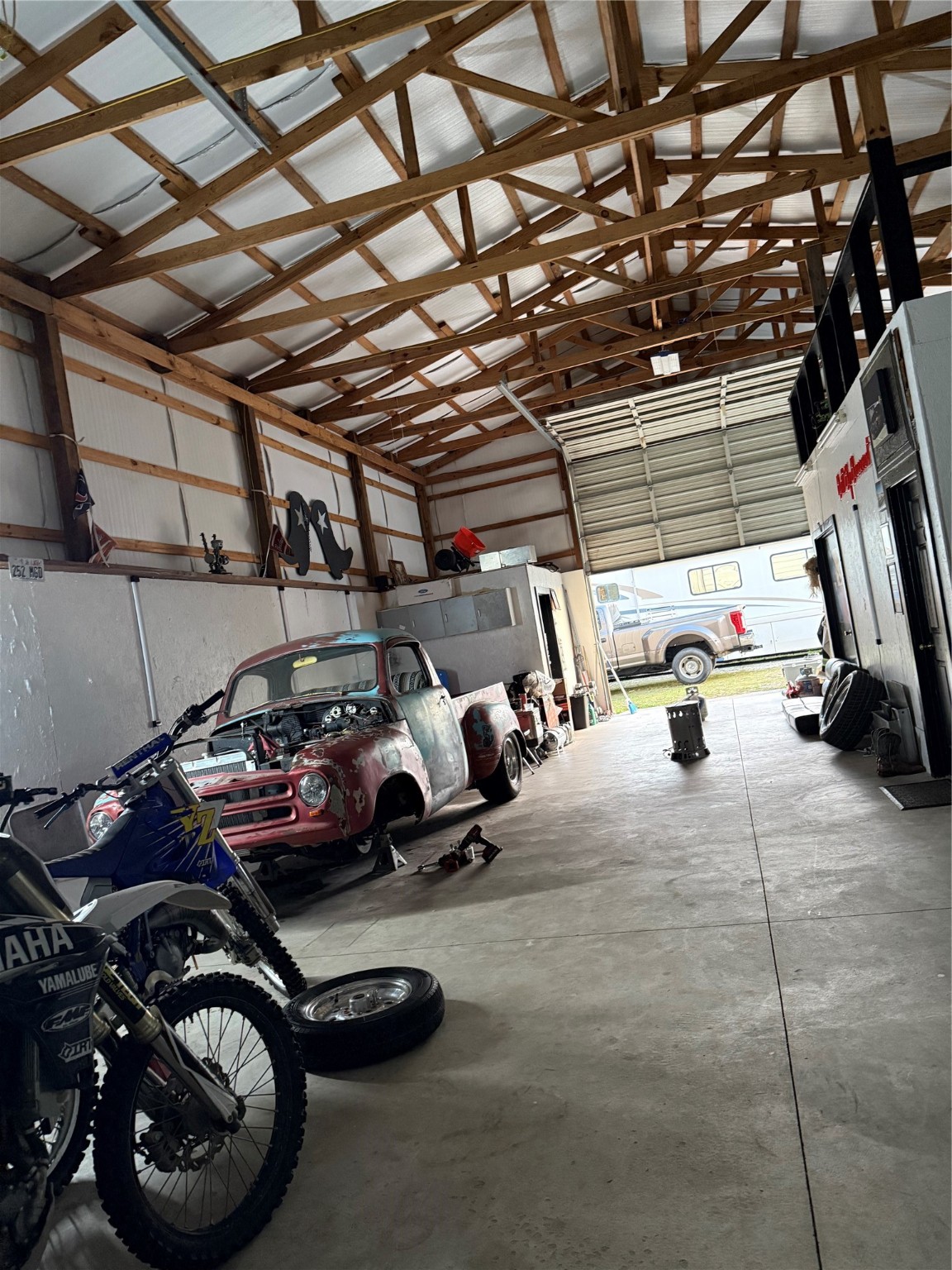 15567 Old Conroe Road Conroe, TX 77384 - Photo 31 of 31 a view of parking garage with cars